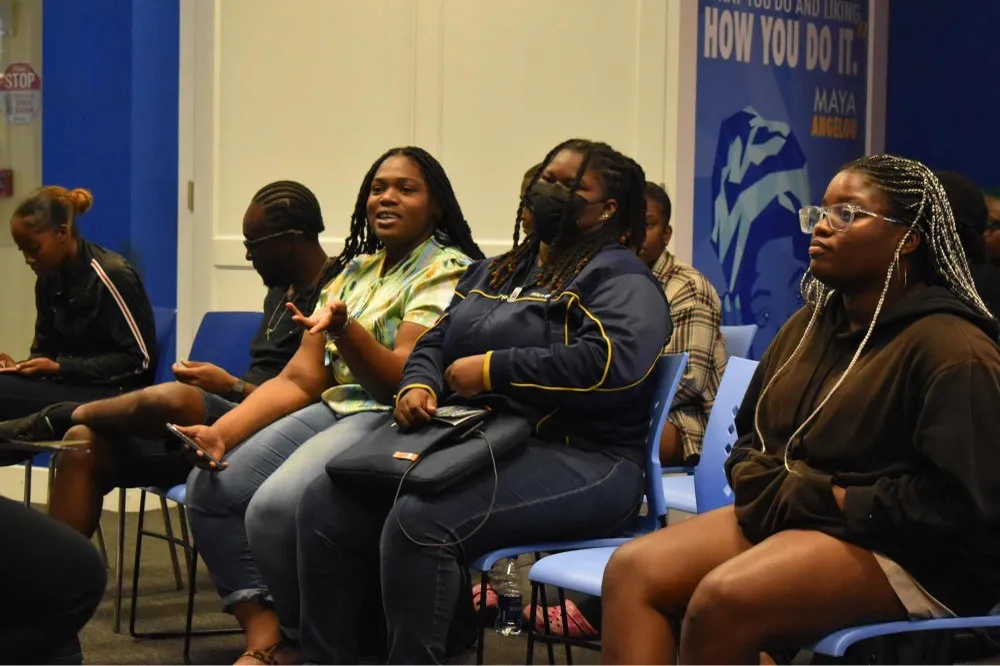 UB student poses a question to the panel